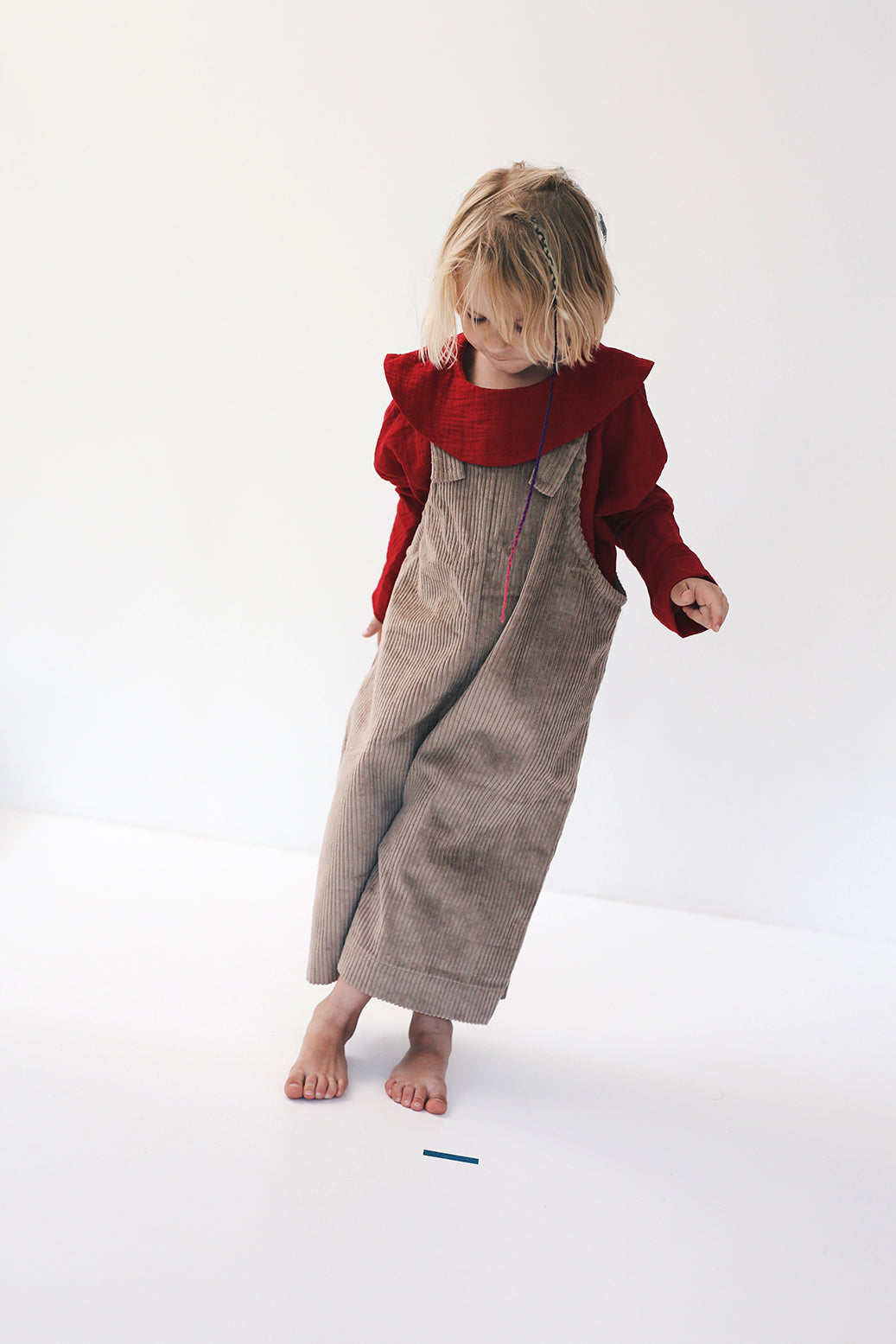 beige dungarees with wide legs- cloth took part in photo session