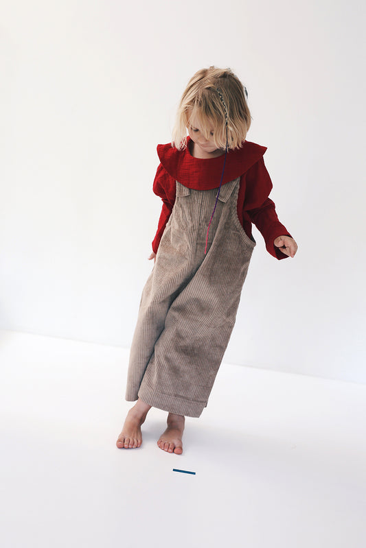 beige dungarees with wide legs- cloth took part in photo session