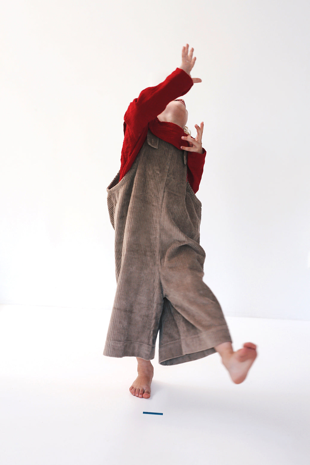 beige dungarees with wide legs- cloth took part in photo session