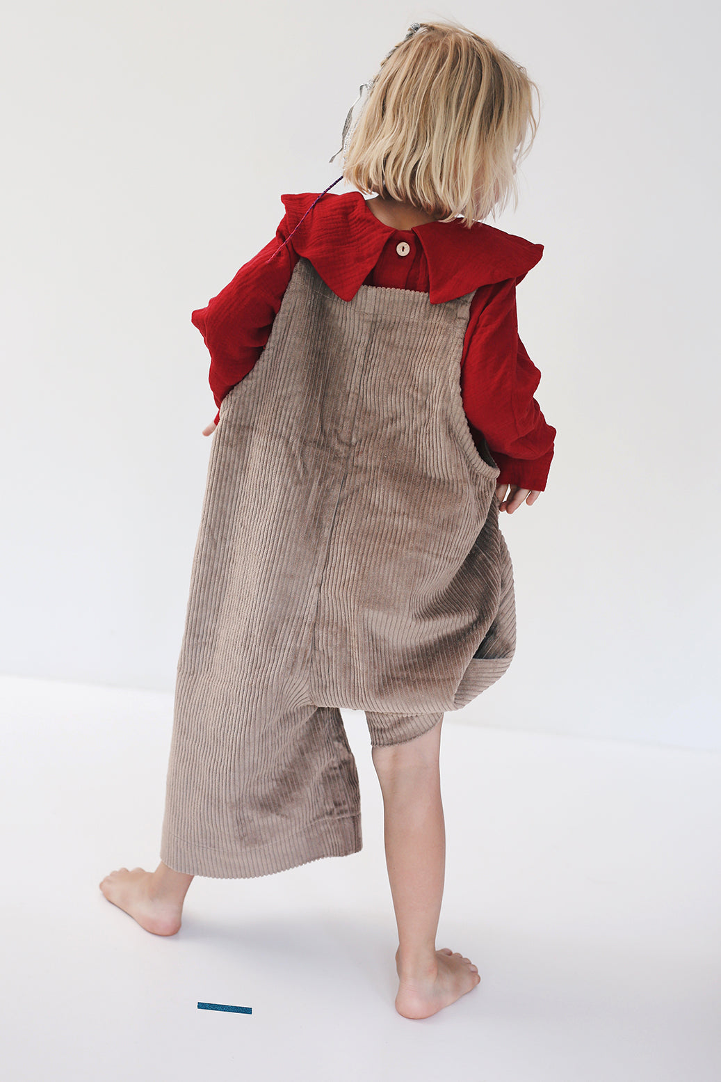 beige dungarees with wide legs- cloth took part in photo session