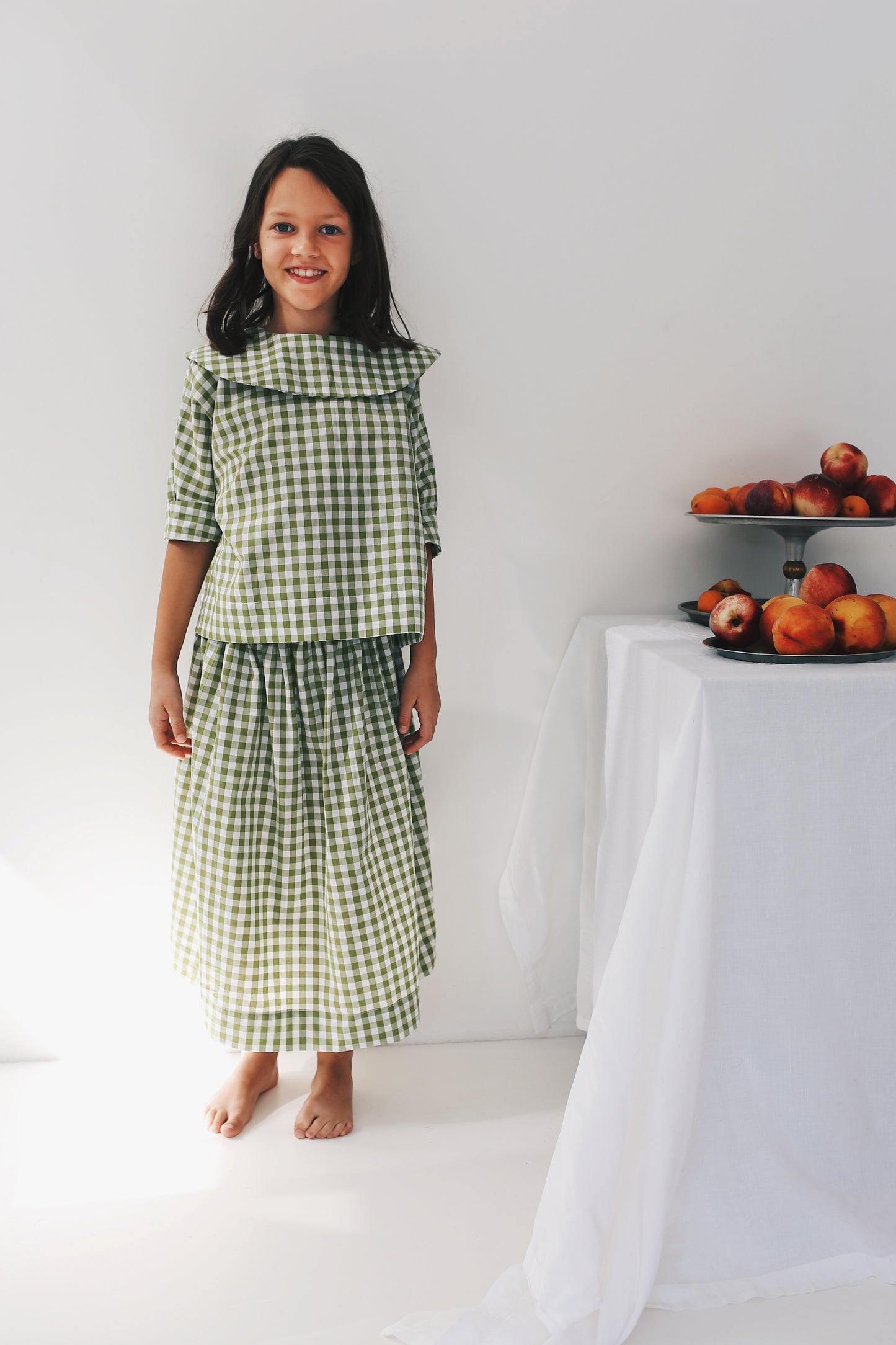 bluzeczka z dużym, okrągłym kołnierzem z krótkim rękawem w różowo-białą kratkę