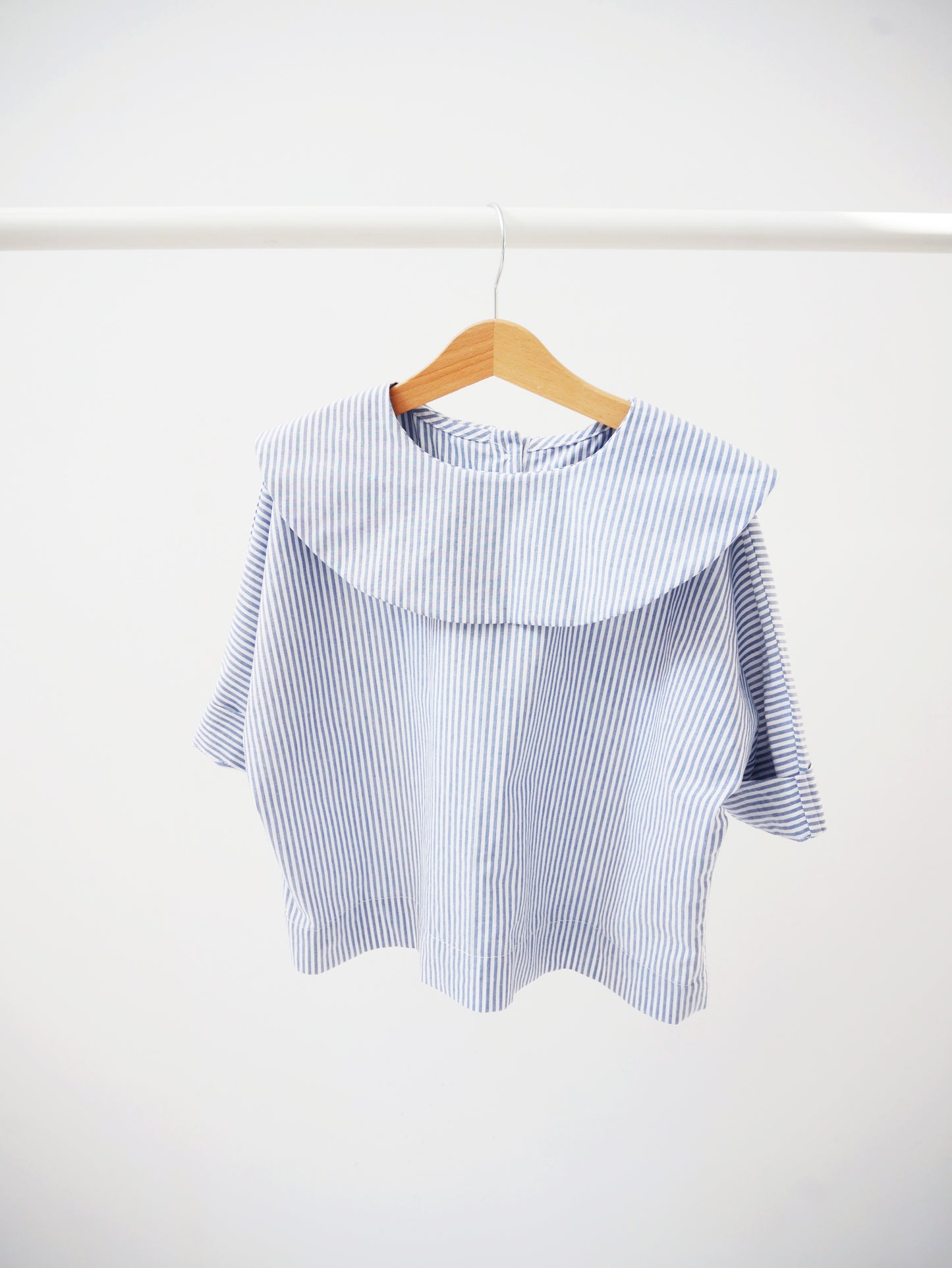 shirt with big, round collar with short sleeves with white and blue stripes