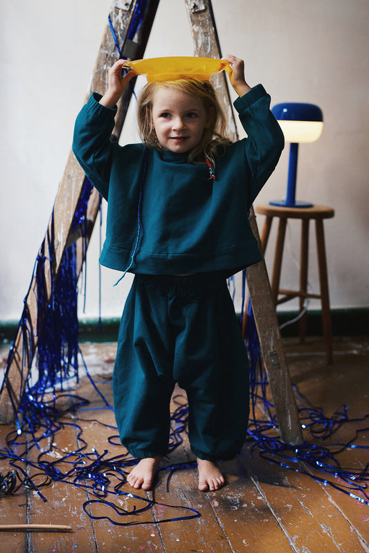 bottle green baggy trousers