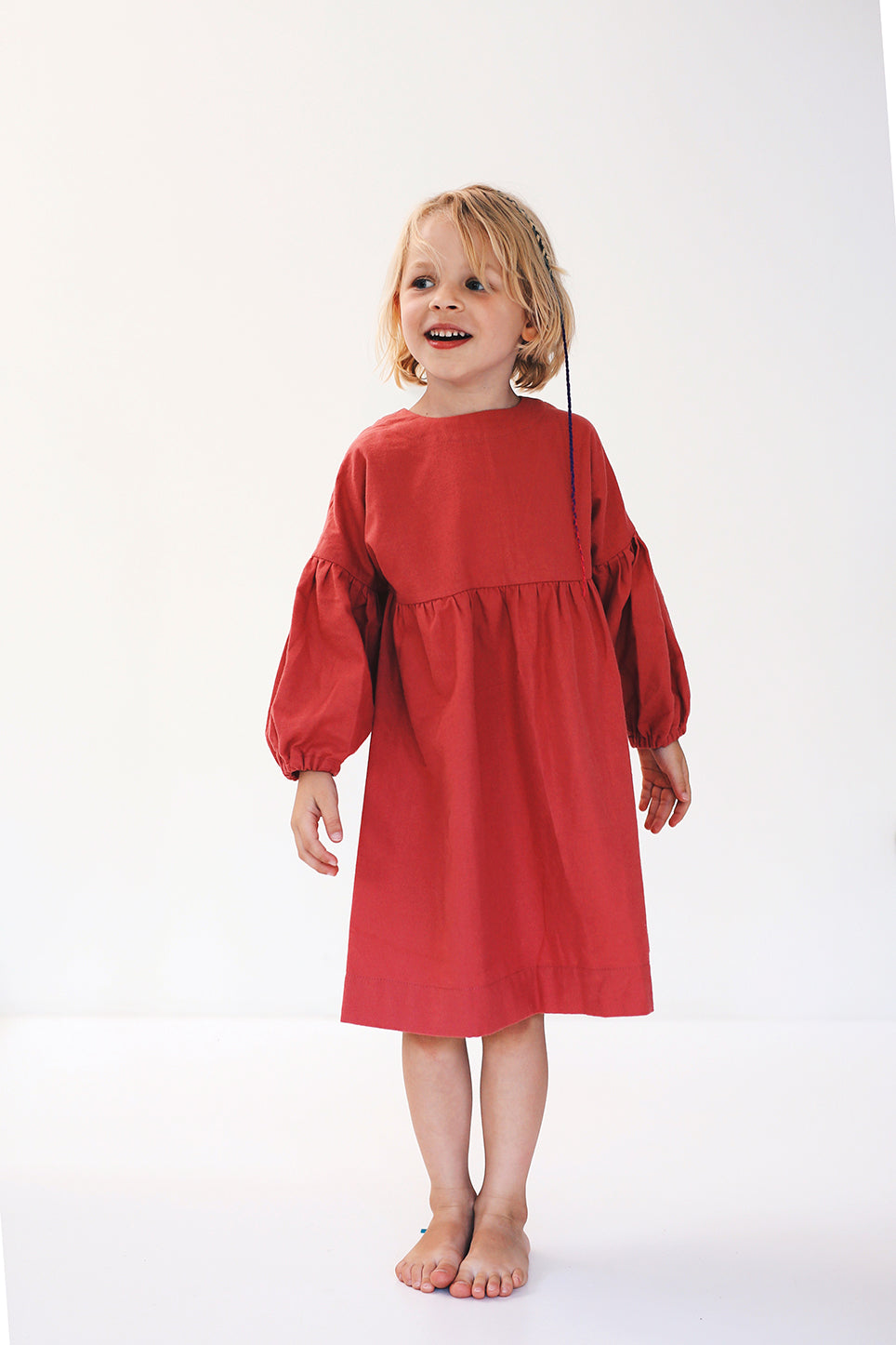 coral dress with long puffed sleeves