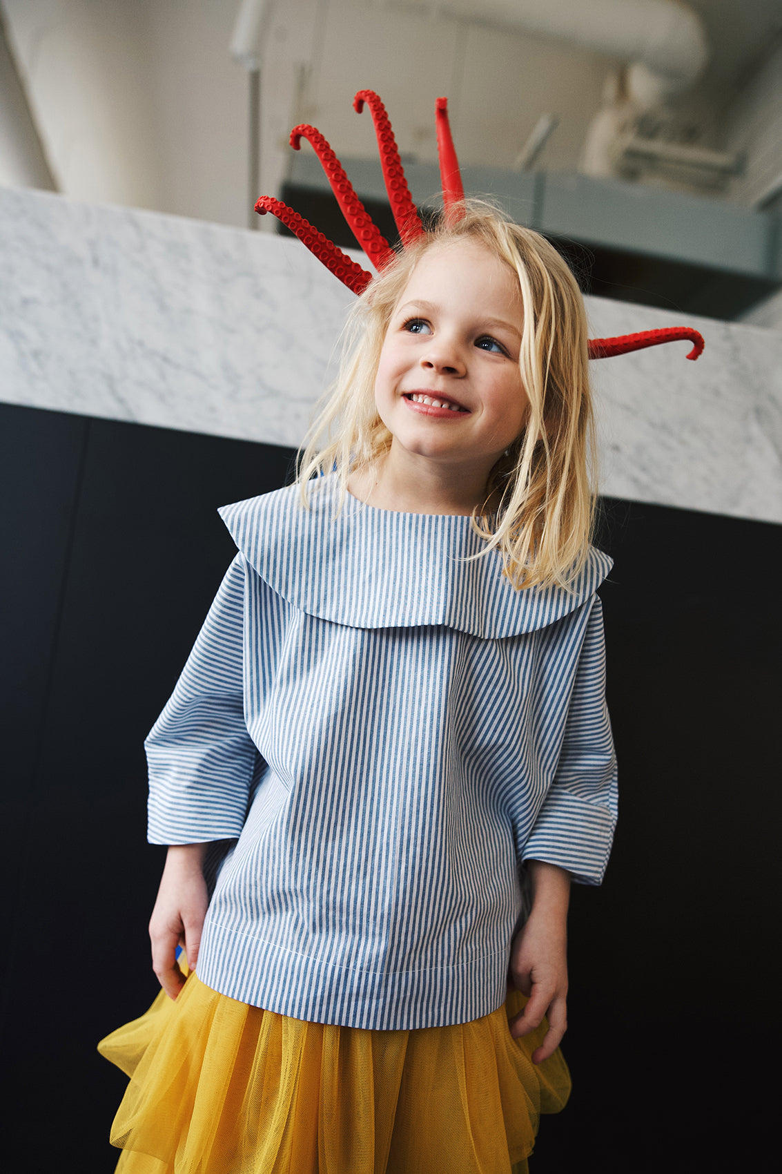 shirt with big, round collar with short sleeves with white and blue stripes