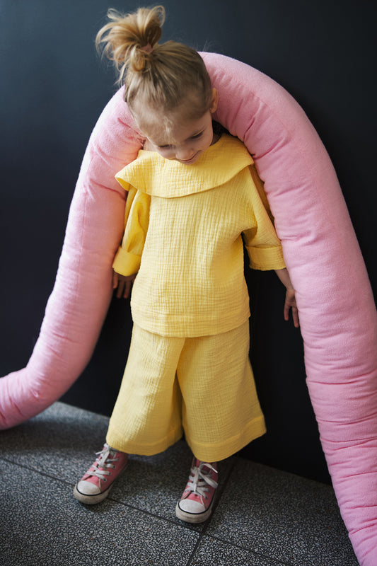 yellow shirt with big, round collar with short sleeves