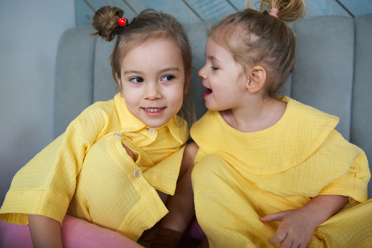 yellow shirt with big, round collar with short sleeves