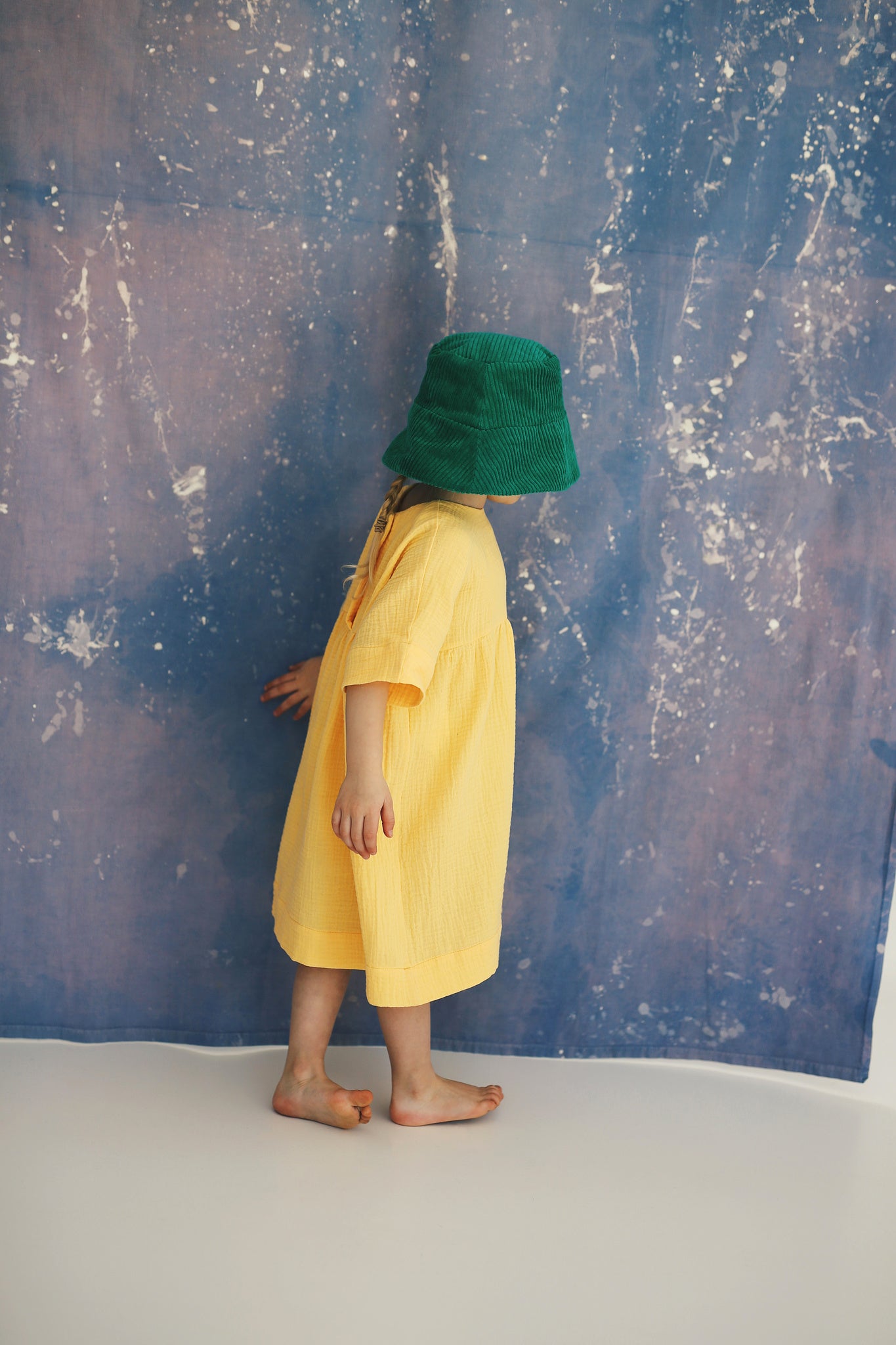 yellow dress with buttons on the back